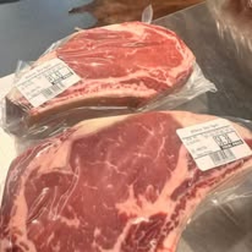Vacuum-sealed bone-in ribeye steaks cut fresh in Murphy, NC