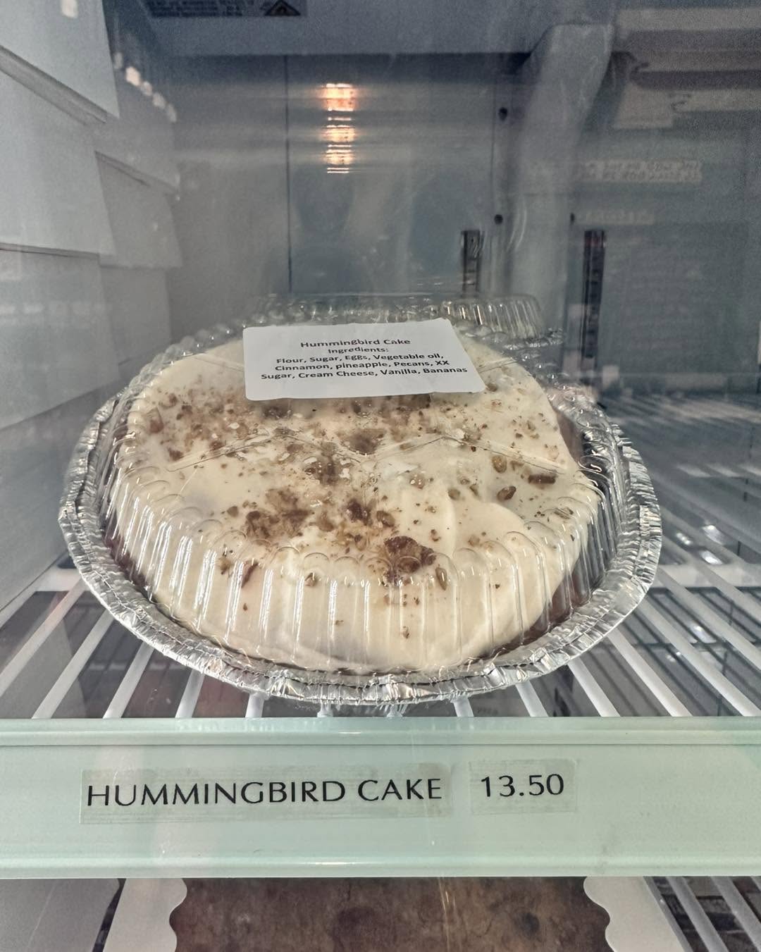 Hummingbird cake in the bakery case at Heifer & Bull Butchery